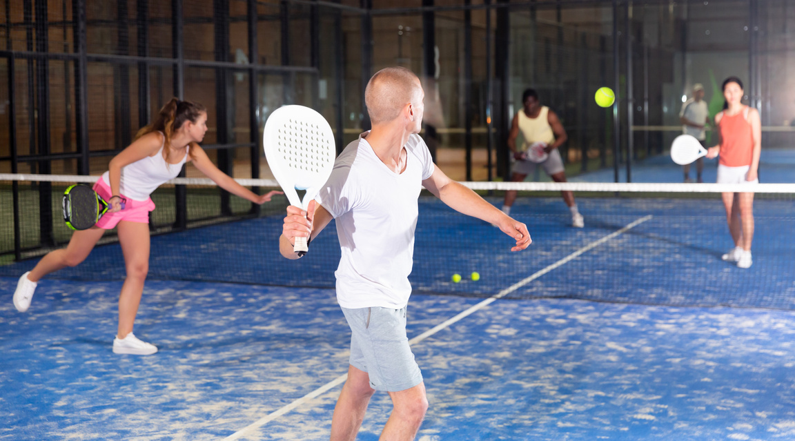 Man playing padel tennis on padel court